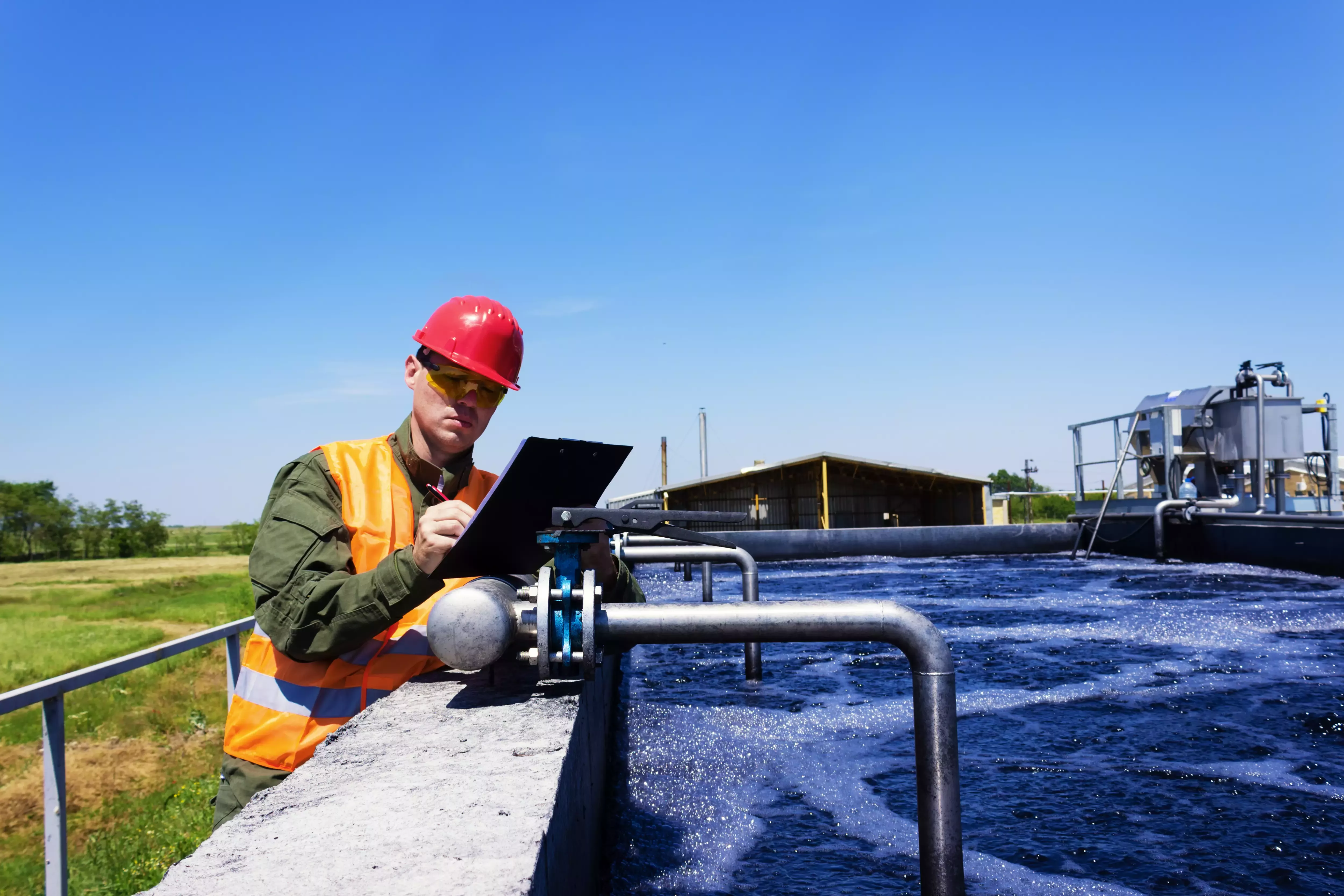 Worker inspecting valve